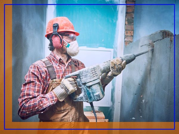 Mason fixes building facade