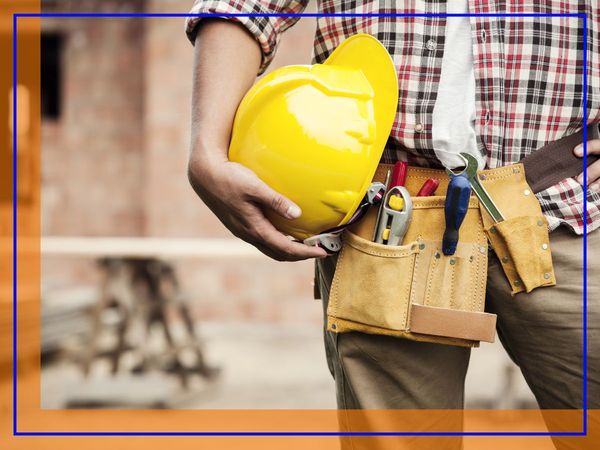 Masonry contractor holds hard hat