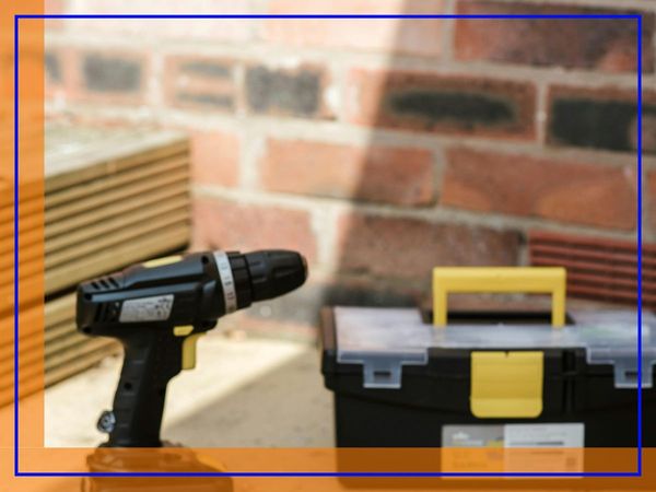 tools and a brick wall